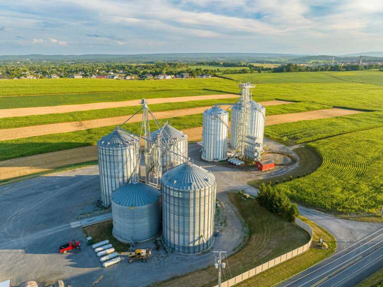 Stoltzfus Grain silos next to a farm field